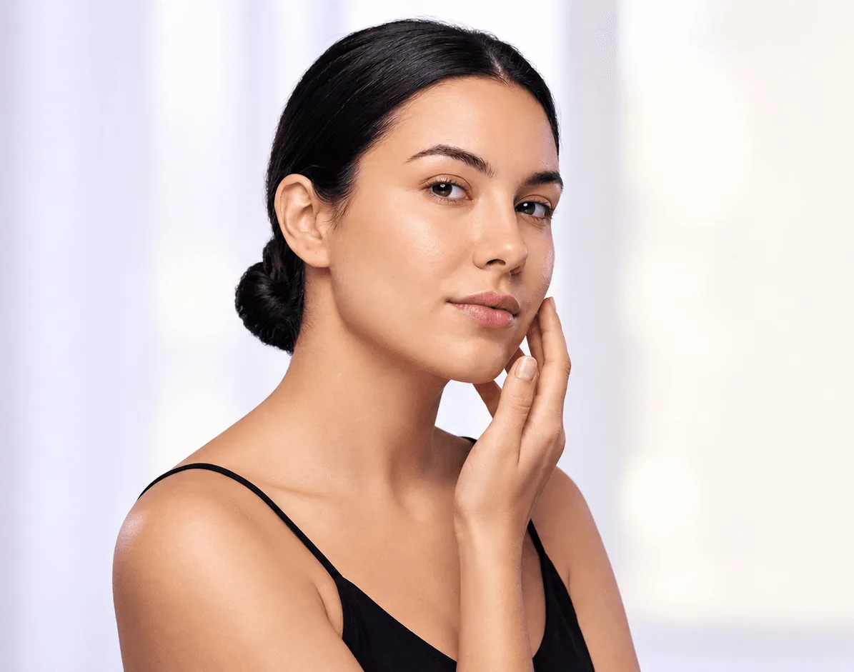 Adult woman with calm, clear skin after professional acne treatment at Applegate Dentistry and MedSpa in Covington