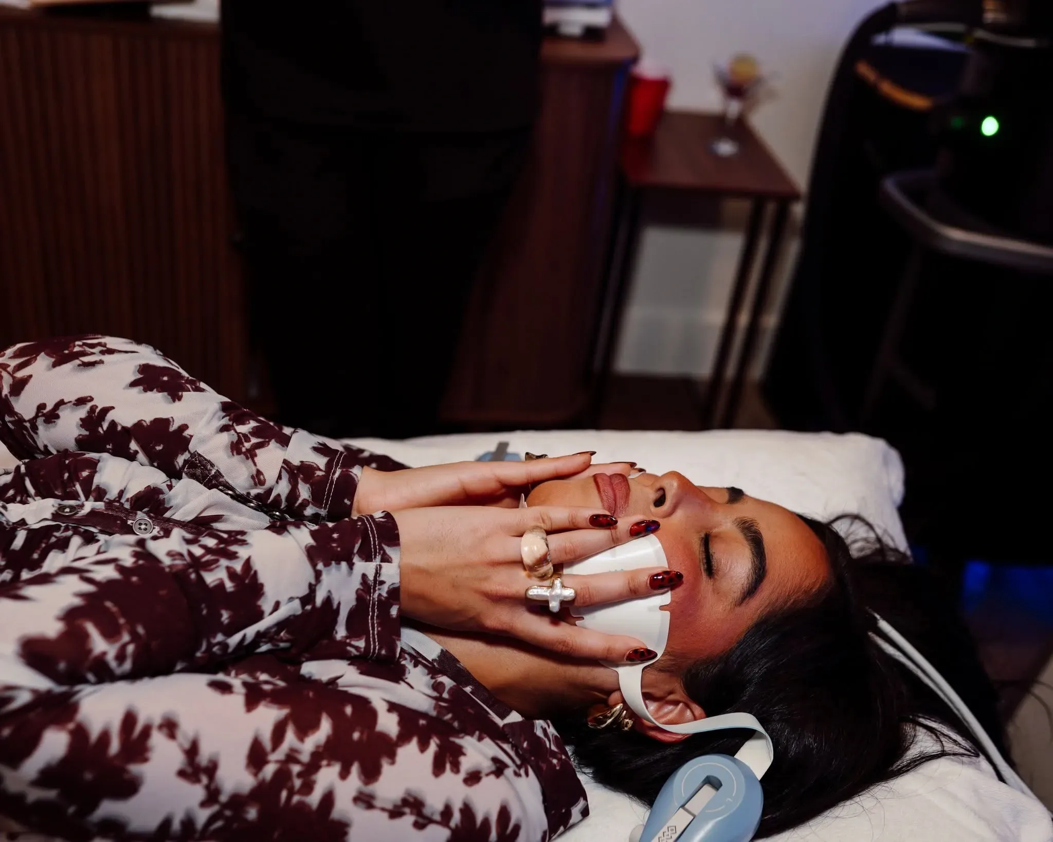 Woman receiving a hands free Emface facial toning session at Applegate Dentistry and MedSpa in Covington, KY