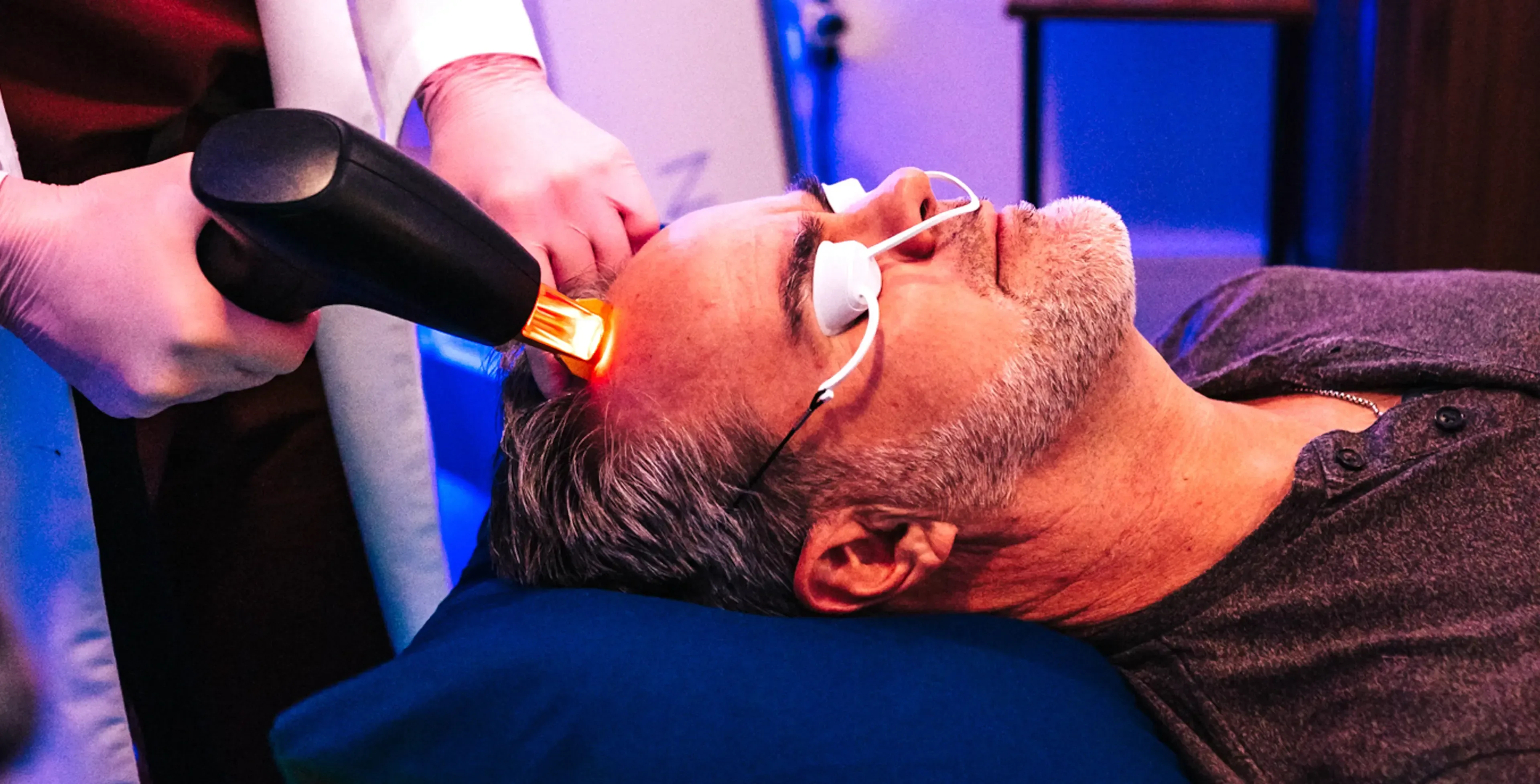 Patient receiving Folix low-level laser hair restoration on the scalp at Applegate MedSpa in Covington, KY