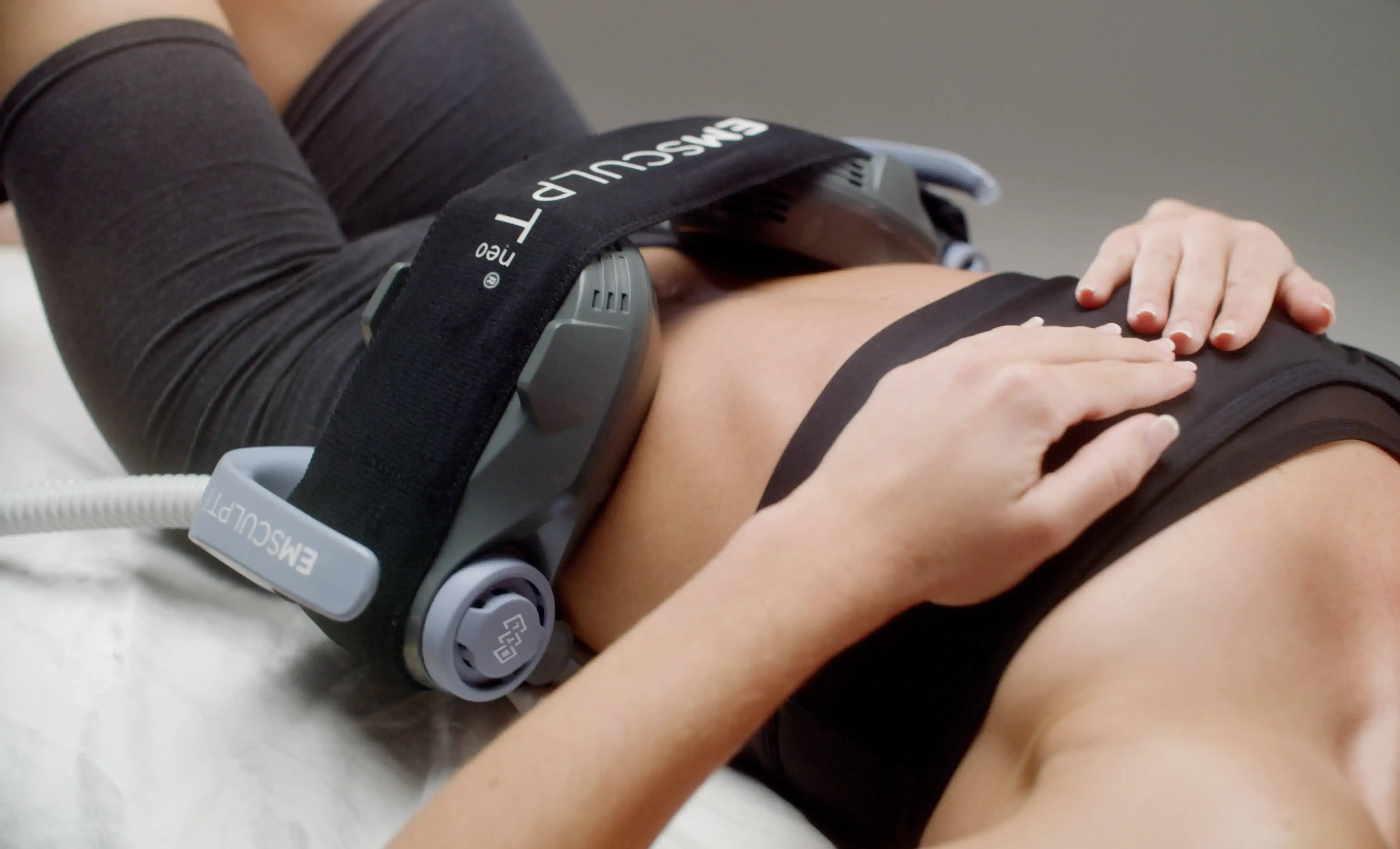 Adult patient lying still during a functional wellness muscle strengthening session in Covington, KY