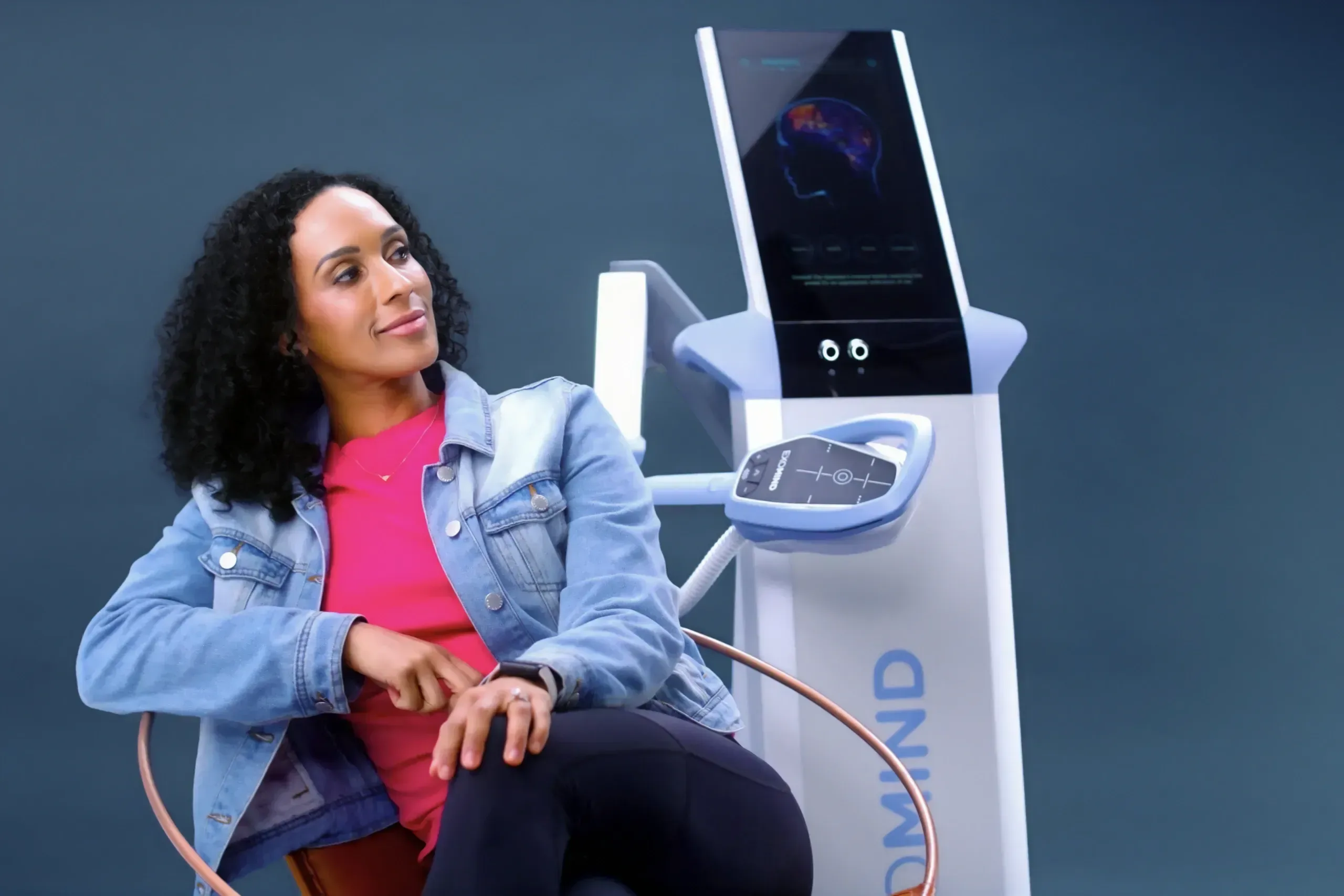 Patient seated comfortably for a TMS therapy session with Exomind at Applegate Dentistry and MedSpa in Covington, KY